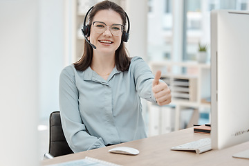 Image showing Sales woman, thumbs up success and telemarketing call center, happy customer service and yes review of agent in office. Portrait of smile crm consultant, winning business trading and consulting agree