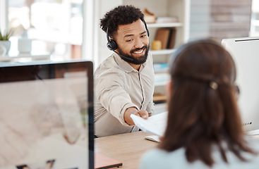 Image showing Paper, call center and smile to woman from man coworker at desk in office. Contact us, crm and customer support worker hands documents to colleague for teamwork, target or learning in consulting job