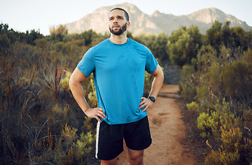 Image showing Nature hiking, run and fitness workout of a man on a calm morning on a mountain park running trail. Health exercise, training and healthy person outdoor on walking or runner break with mountains view