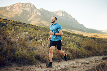 Image showing Running, fitness and mountain nature park road run of a man runner outdoor for exercise. Training, sport and workout of a athlete with fast energy and stamina on a walking and hiking dirt trail