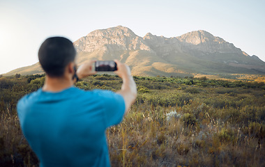 Image showing Mountain, hiking man and smartphone photography in nature, outdoors or countryside. Adventure, travel and man on 5g mobile taking landscape picture for online social media, good memory or post on web