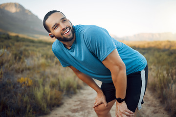 Image showing A tired runner, man on nature run for fitness exercise and marathon training cardio health workout. Sports athlete working out, train for sport competition and rest after running on natural dirt road