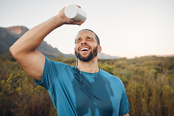 Image showing Sports man splash water bottle on face in nature hiking, running or outdoor exercise in Spain mountain adventure. Runner spray drinking water on head for cardio training, cool body sweat and wellness
