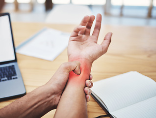 Image showing Businessman, wrist pain and injury at desk working, planning and writing in workplace with laptop. Painful muscle, male hand and overworked from typing with sore arm, notebook at work table.