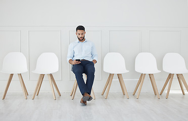 Image showing Hiring, smartphone and businessman in recruitment waiting room for social media marketing and advertising interview with HR. Human resources, job career and 5g social network expert review digital cv