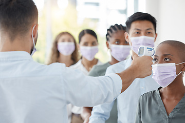 Image showing Covid compliance, business and people with face mask testing with thermometer at security to check symptoms for office policy. Diversity, employees and corona virus safety for men and women at work