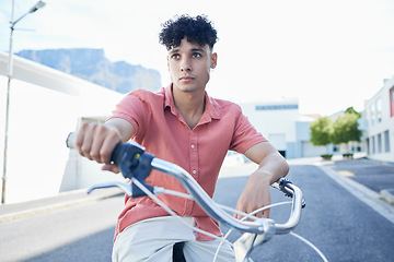 Image showing Bicycle, eco friendly travel and young man, active lifestyle and clean carbon footprint in cityscape. Gen z youth, cycle and commute, sustainability and environment, wellness and fitness outdoors.
