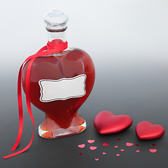 Image showing Love Potion Bottle with Red Heart Decorations