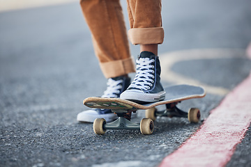 Image showing Street, skateboard and riding shoes travel with balance for outdoor skating leisure practice. Stylish skateboarder man on concrete road for adventure trip with vintage, retro and shoe sneakers.