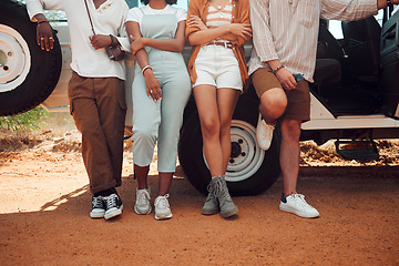 Image showing Friends, road trip and travel outdoor break of people using motor transportation. Diversity of friend group standing on a dirt trail at a vehicle in the summer sun together ready for a holiday