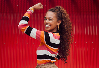 Image showing Beauty, fashion and strong with a black woman flexing her bicep outdoor on a red background with a smile. Empowerment, proud and strength with an attractive young female showing her arm muscle