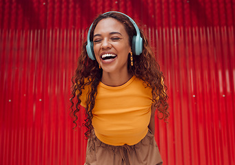 Image showing Urban, joy and woman with headphone music enjoying happy rhythm with bluetooth connection. Smile of latino girl listening to feel good streaming audio while resting at wall for leisure break.