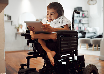 Image showing Wheelchair, disability and child with tablet for learning, video or games in home. Cerebral palsy, boy and disabled use tech on internet, app or web for development of brain, mind and education