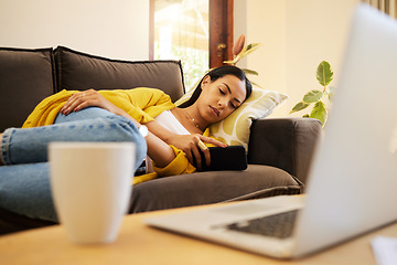 Image showing Tired woman, phone and relax for work break at home lying on living room sofa with technology. Female freelancer overworked, burnout and relaxing on a couch texting or streaming on mobile smartphone