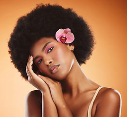 Image showing Black woman, beauty and makeup, skin and face with flower, hair and natural cosmetics advertising. African American model, skincare and cosmetology treatment, glow in portrait with studio background.