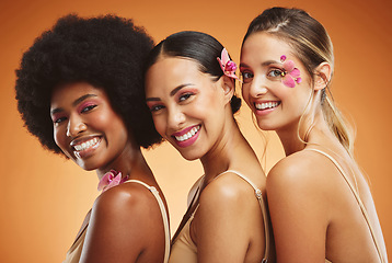 Image showing Beauty, skincare and diversity with a model woman group in studio on an orange background for health or inclusion. Wellness, makeup and face with a portrait of female friends posing for empowerment