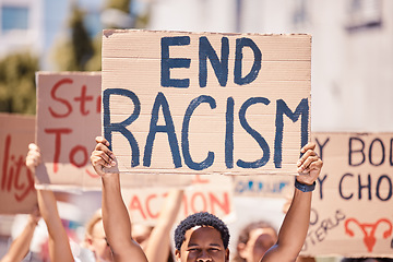 Image showing Protest, racism poster and walking people for human rights, black lives matter and inequality movement on city street in USA. Angry crowd with sign for freedom, justice and change in government