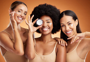 Image showing Beauty, skincare and portrait of women with smile in studio with face cream or moisturizer. Happiness, diversity and friends with facial routine for cosmetics, health and wellness by brown background