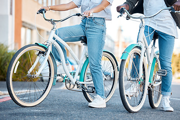 Image showing Couple, bicycle and legs in the street of a city for travel, exercise or adventure in the outdoors. Interracial man and woman on bikes for cycling tour in a urban town or traveling in South Africa