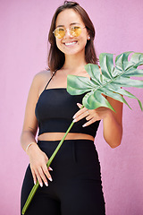 Image showing Fashion, asian and portrait of woman with leaf of monstera plant in the city with cheerful smile. Young, happy and trendy girl enjoying summer leisure with funky, retro and vintage sunglasses.