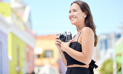 Image showing Photography, summer and happy photographer with camera shooting pictures of colorful houses in the city. Smile, woman and creative freelancer takes a photo of Cape Town on a holiday vacation outdoors