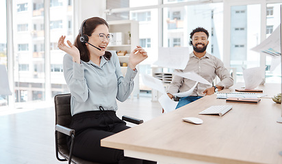 Image showing Call center, customer service and excitement with a woman consultant celebrating sales at work on a headset. Ecommerce, contact us and crm with a surprised female happy at success in telemarketing