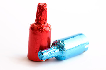 Image showing Colorful chocolate bottles