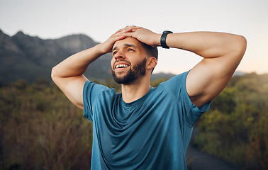 Image showing Tired, sweat and fitness man in nature taking break or rest after running, workout and training in countryside for health. Athlete runner exhausted after hiking or run on trail for cardio exercise