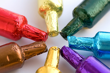 Image showing Colorful chocolate bottles