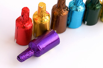 Image showing Colorful chocolate bottles