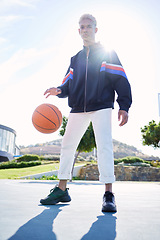 Image showing Basketball, game and black man with fashion on court while training for fitness and exercise during summer. Portrait of an African athlete with ball for sports event, competition or match in the USA