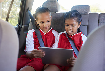 Image showing Children, friends and tablet in car entertainment, online streaming or social media. Kids enjoying games or apps while relaxing in seat on touchscreen technology after sports training or soccer match