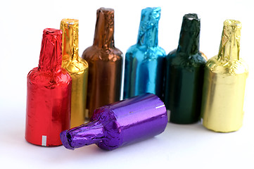 Image showing Colorful chocolate bottles