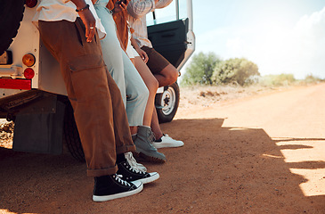 Image showing Legs, travel and friends on a road trip with a car for holiday in Kenya together during summer. Feet of a group of people on vacation for adventure, freedom and peace with a car in the countryside