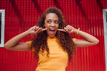 Image showing Fashion, summer and woman with smile on red background in city. Beauty, freedom and happy girl on holiday touching face in cute, silly and goofy pose. Excited, happiness and adventure in urban town