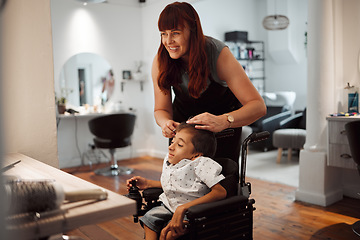 Image showing Hairdresser, barber and disability for child in wheelchair in salon, parlour or barbershop. Stylist, woman and happy for service to disabled kid with cerebral palsy in shop, store or small business