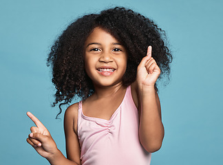 Image showing .Children, dance and fun with a girl kid dancing in studio on a blue background for freedom or expression. Kids, happy and smile with a cute female child dancer feeling positive or carefree inside.