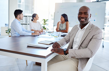 Image showing Black man, business meeting and portrait in office, startup and teamwork planning in corporate company. Happy, smile and vision of executive businessman at table with motivation, goal and innovation