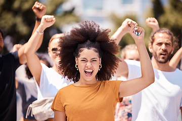 Image showing Freedom, support and protest with black woman and fist with crowd in city street for global justice and human rights revolution and equality. Support, future and change with group of people in rally