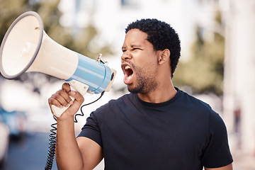 Image showing Megaphone, protest and angry black man talking at riot in Nigeria. Announcement, loudspeaker and shouting or screaming male on bullhorn protesting for freedom, justice or government change in city.