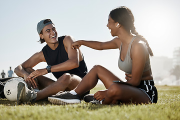 Image showing Fitness, friends and soccer grass break by man and woman relax, laugh and enjoy conversation on a soccer field. Wellness, couple and cheerful interracial lady and guy bonding after football training