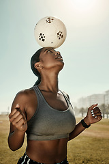 Image showing Woman, soccer ball and balance on head in training grass field, sports ground or fitness training club. Football player, black woman and athlete in exercise practice with wellness goals or motivation