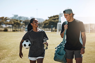 Image showing Soccer players, people or team walking after fitness, training and workout on grass field. Smile, happy and talking football friends, couple or man and woman bonding after sports exercise or wellness