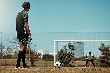 Image showing Training, goal and soccer player with goalkeeper at sports field for target, score and practice. Fitness, exercise and sport game with football athlete thinking of game strategy before ball kick