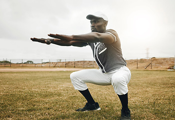 Image showing Baseball player, stretching and black man on sports field doing warm up exercise, workout practice for match. African male athlete outdoor with tshirt and cap for health, wellness and energy on pitch