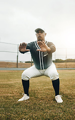 Image showing Baseball player, stretching and sports man doing squats on field for warm up exercise, workout and practice for match. Male athlete with tshirt and cap for health, wellness and energy on match pitch