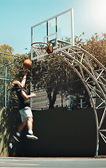Image showing Jumping man, basketball court and scoring goals in fitness workout, training or exercise for health, wellness or professional competition. Sports, energy and player in slam dunk winner game and match