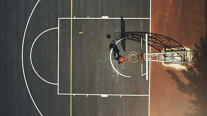 Image showing Top view, basketball court or man scoring goals in fitness workout, training or exercise for health, wellness or heart cardio. Sports, energy or basketball player in winner game, math or competition