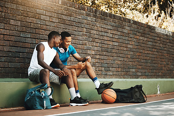 Image showing Friends, phone and break after exercise, workout and basketball game in city with men bonding and laughing. Sports, rest and two guys having fun, enjoying social media comedy, post and online meme