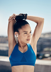Image showing Fitness, urban stretching and woman with earbuds and wireless music for marathon running. Health, wellness and sports, listening to streaming app for motivation, exercise and street stretch workout.